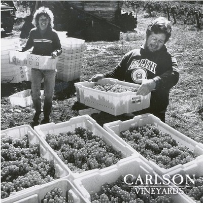 Parker and Mary Carlson toting freshly picked grapes
